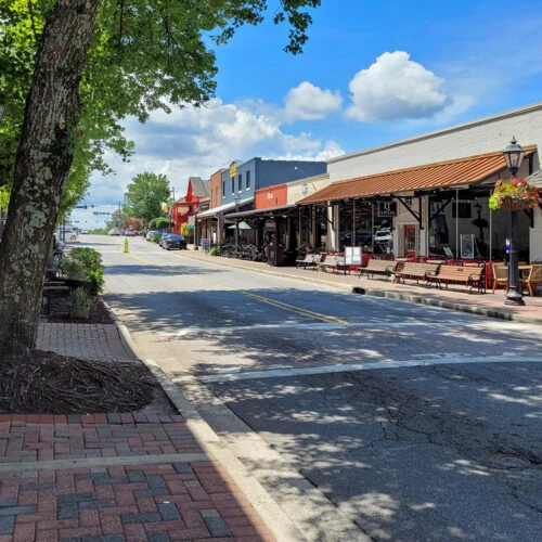 Historic downtown Roswell, Georgia storefronts along a brick sidewalk