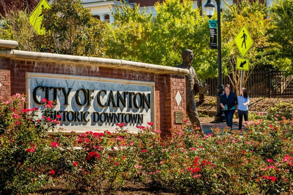 City of Canton historic downtown sign surrounded by flowers in Georgia
