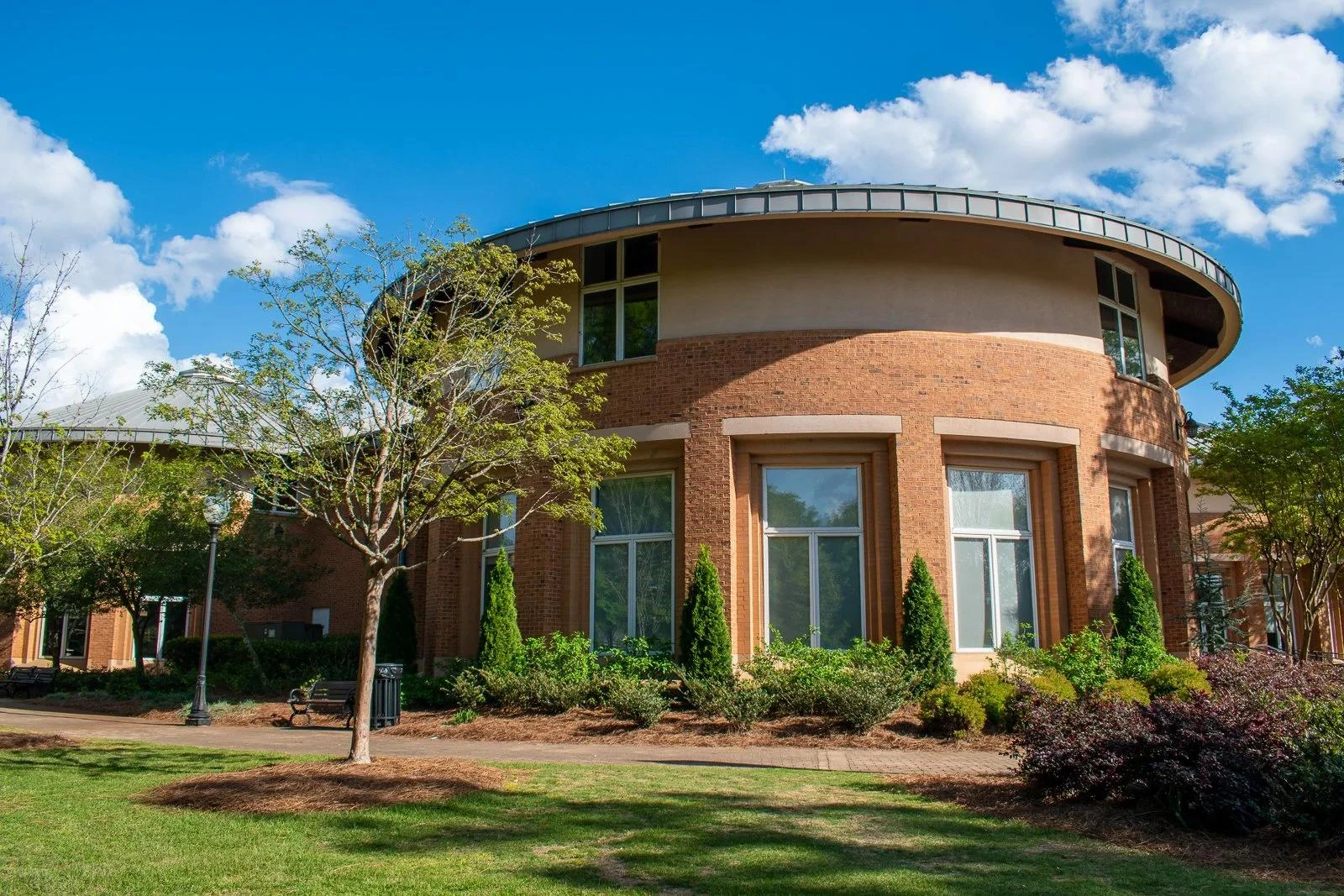 Curved brick building with landscaped gardens and lawn in Smyrna, Georgia